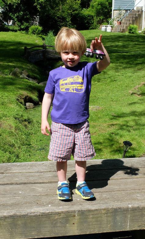 Boy wearing Purple MBTA Commuter Rail Locomotive Train t-shirt